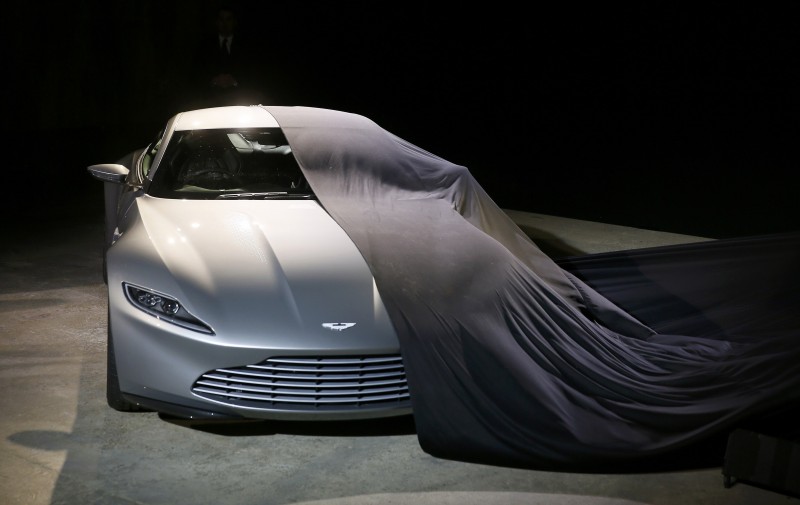 An Aston Martin DB10 car is unveiled on stage during an event to mark the start of production for the new James Bond film "Spectre" at Pinewood Studios