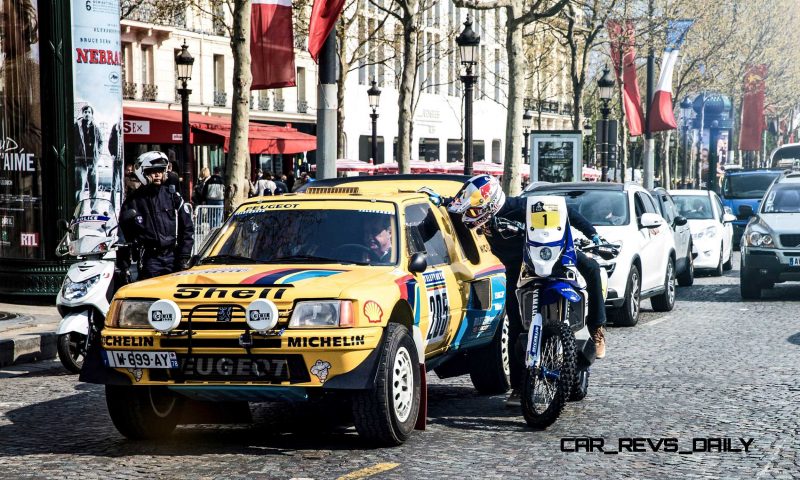 Cyril Despres speaks with Carlos Sainz on the Champs Elysees, Pa