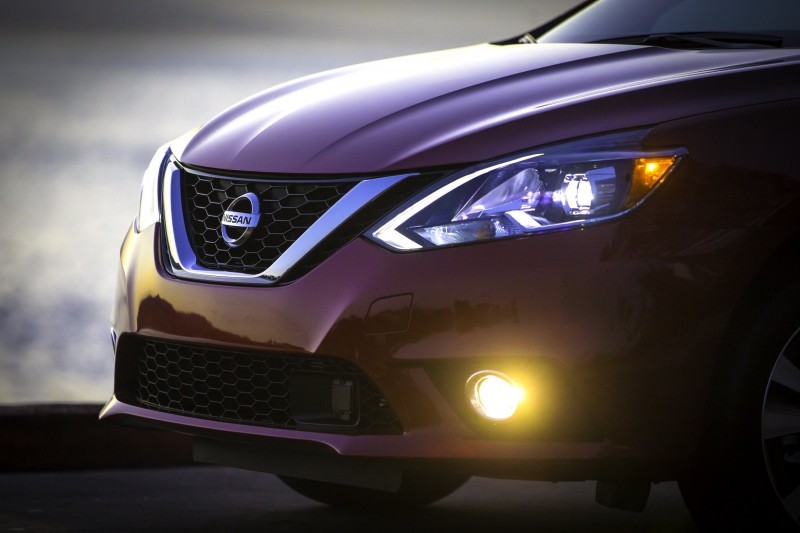 The new 2016 Nissan Sentra exterior redesign brings its appearance closer in look and feel to its more upscale showroom siblings. All three Nissan sedans – Maxima, Altima and now Sentra – reflect Nissan’s new design language first introduced on the dramatic Nissan Murano crossover. Key features of the 2016 Sentra exterior include a new front fascia, grille, fenders, hood and signature boomerang-shaped headlights. New LED low-beam headlights with LED signature accents are offered on Sentra SR and Sentra SL grades. In the rear, a new fascia with redesigned boomerang-shaped taillights adds a more premium appearance. There are also two new 17-inch wheel designs for SR and SL grades, as well as a new SV 16-inch aluminum-alloy wheel design.