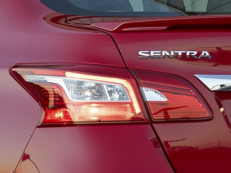 The new 2016 Nissan Sentra exterior redesign brings its appearance closer in look and feel to its more upscale showroom siblings. All three Nissan sedans – Maxima, Altima and now Sentra – reflect Nissan’s new design language first introduced on the dramatic Nissan Murano crossover. Key features of the 2016 Sentra exterior include a new front fascia, grille, fenders, hood and signature boomerang-shaped headlights. New LED low-beam headlights with LED signature accents are offered on Sentra SR and Sentra SL grades. In the rear, a new fascia with redesigned boomerang-shaped taillights adds a more premium appearance. There are also two new 17-inch wheel designs for SR and SL grades, as well as a new SV 16-inch aluminum-alloy wheel design.