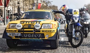 Cyril Despres speaks with Carlos Sainz on the Champs Elysees, Pa