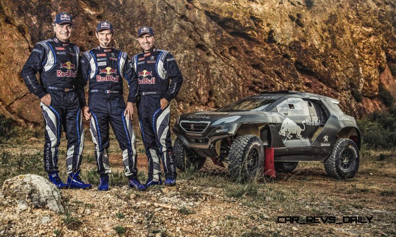 Carlos Sainz, Cyril Despres and  Stephane Peterhansel pose for a